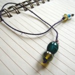 Purple, Yellow, & Teal Beaded Thong Bookmark by Denise Chaney