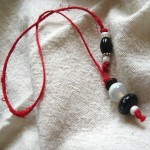 Red, Black, & White Beaded Thong Bookmark by Denise Chaney